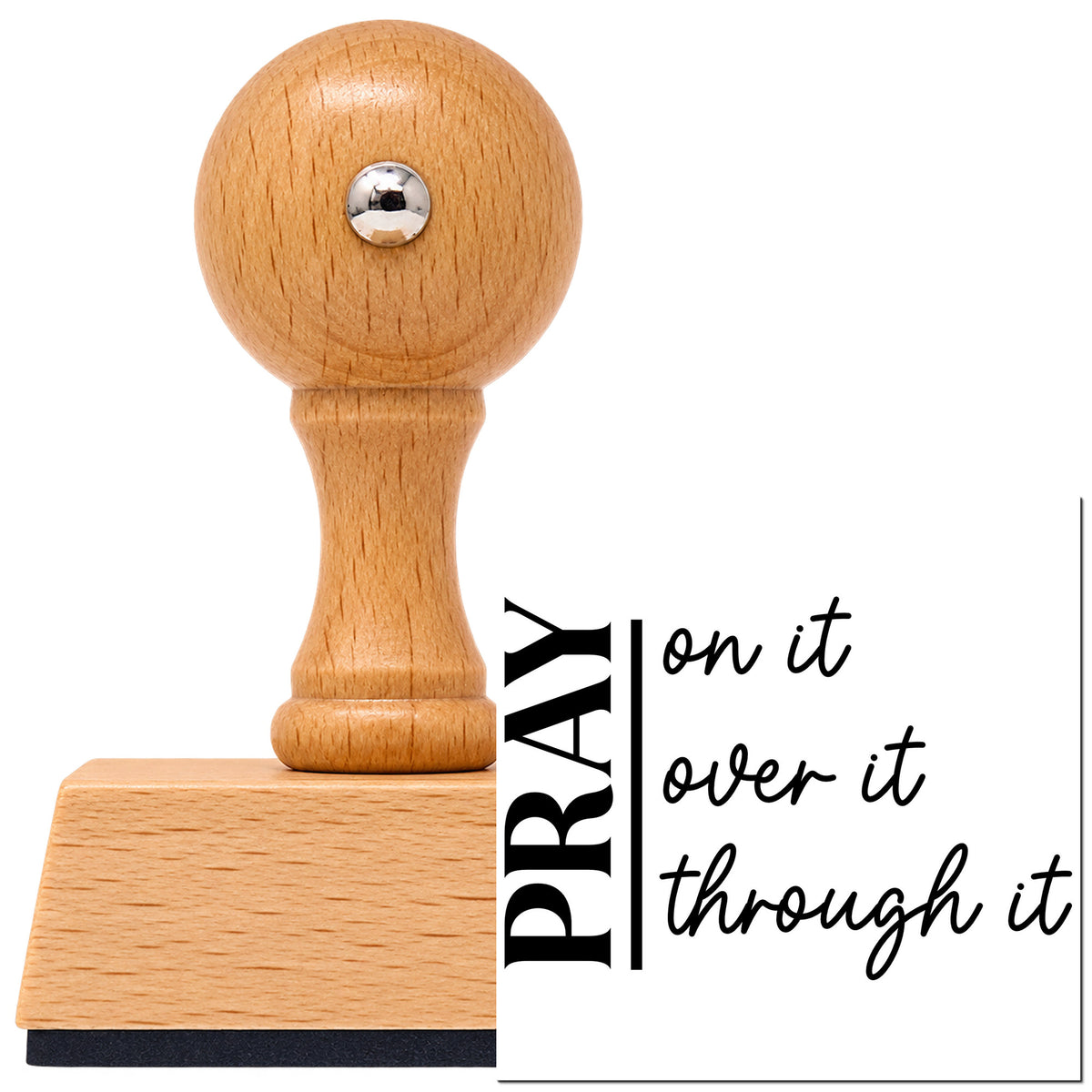 Vintage Pro beech wood stamp with a round knob handle, shown with its black Pray On It Over It Through It imprint on white.