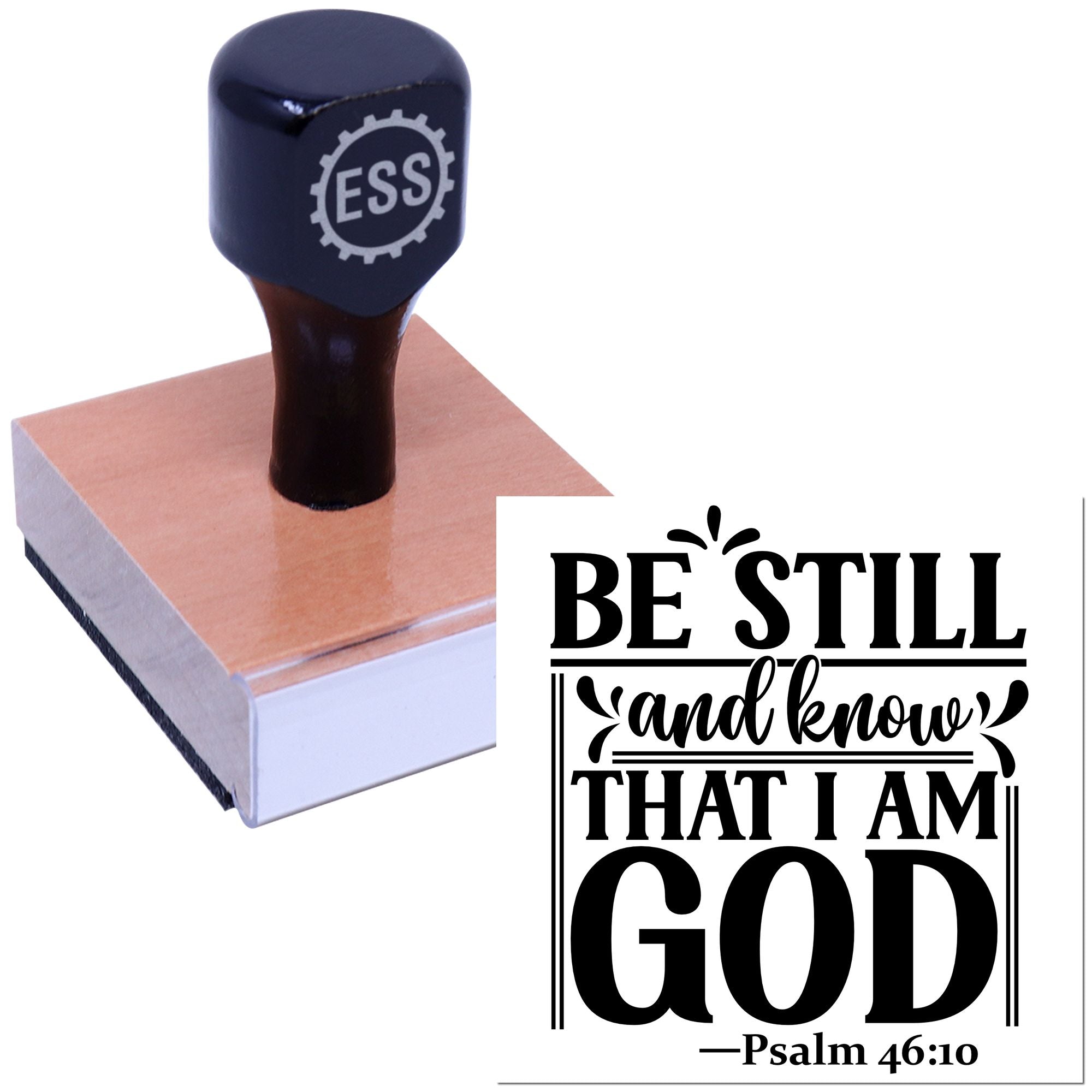 Black self-inking stamp and seal with wooden base, featuring bold white-and-black Be Still and know that I am God Psalm 46:10 text.