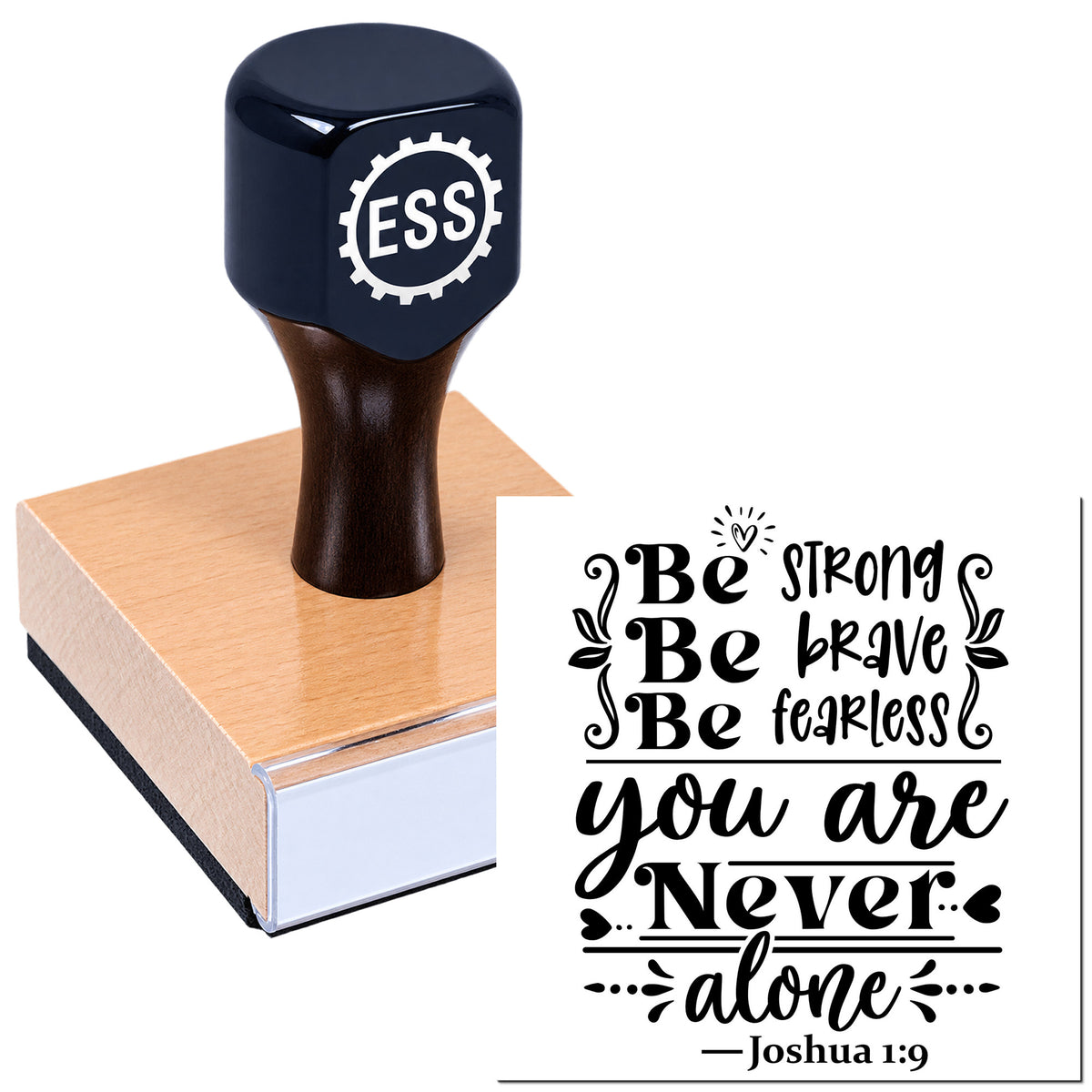 Black ESS rubber stamp with wooden base beside a bold black "Be strong...you are never alone" seal design on white.