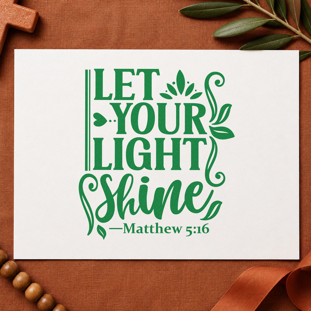 Let Your Light Shine Leaves craft stamp imprint in green ink on a handmade project, one idea being framed nursery art.