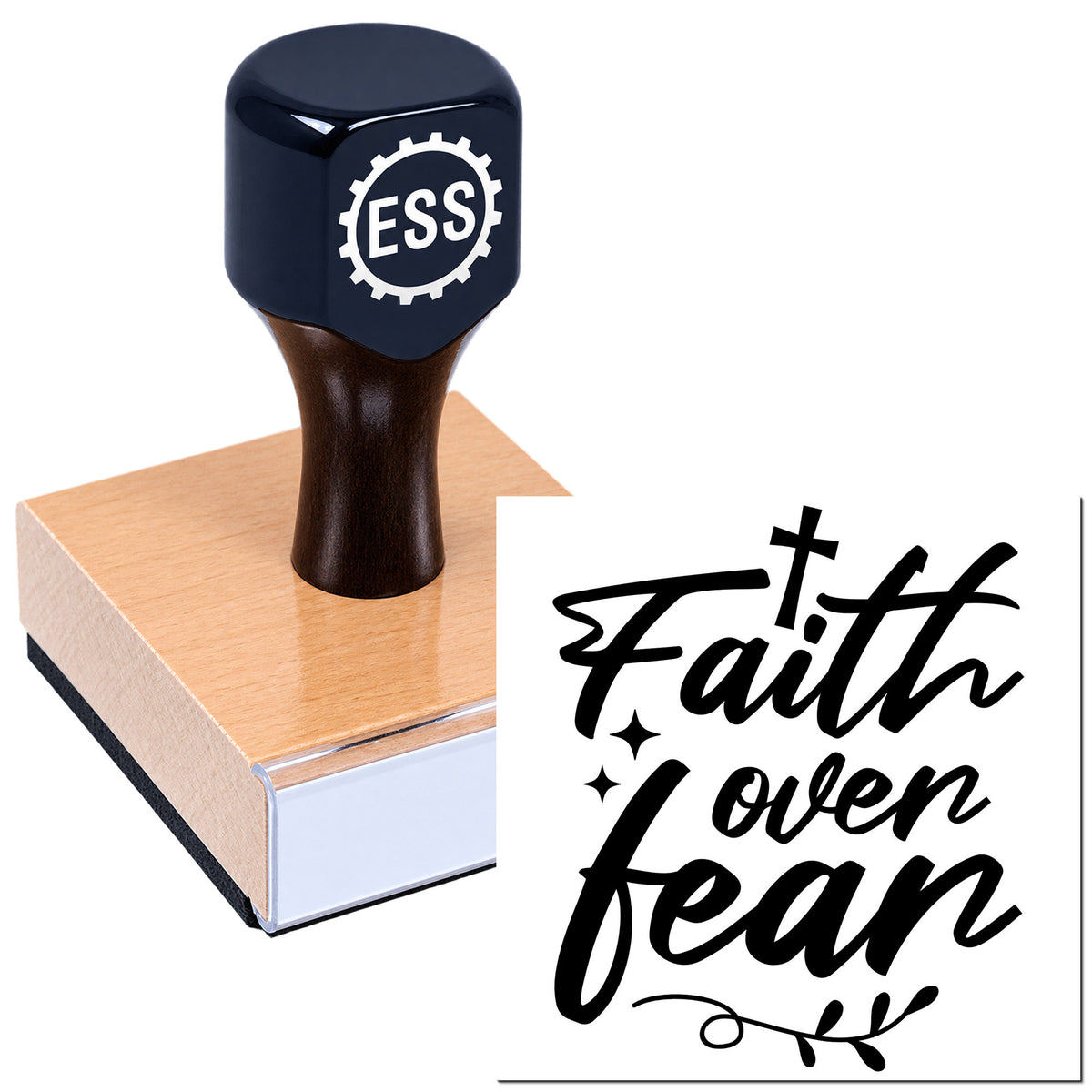 Black ESS rubber stamp on pink wood block with "Faith over fear" seal design.
