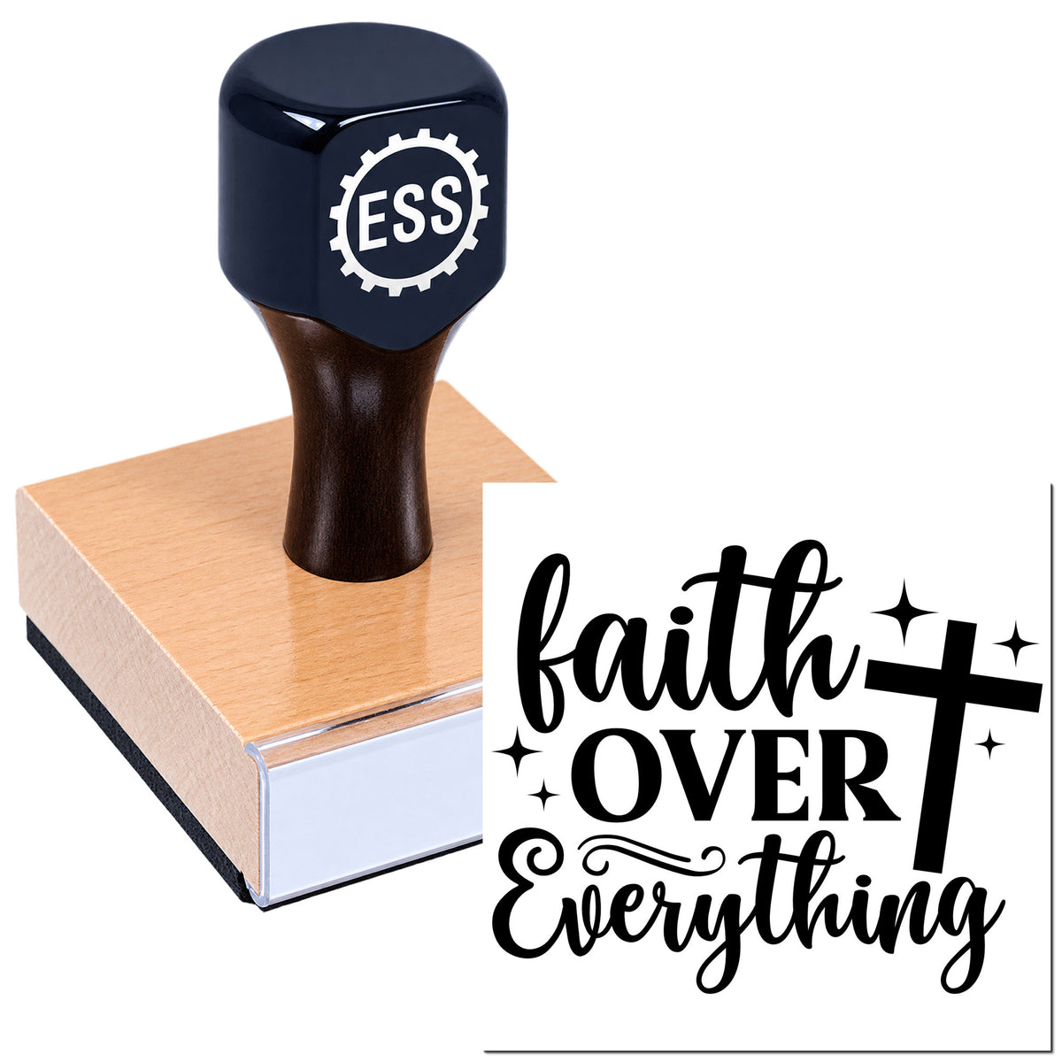 Black ESS rubber stamp on wooden block with "faith over everything" cross seal design, black and white accents