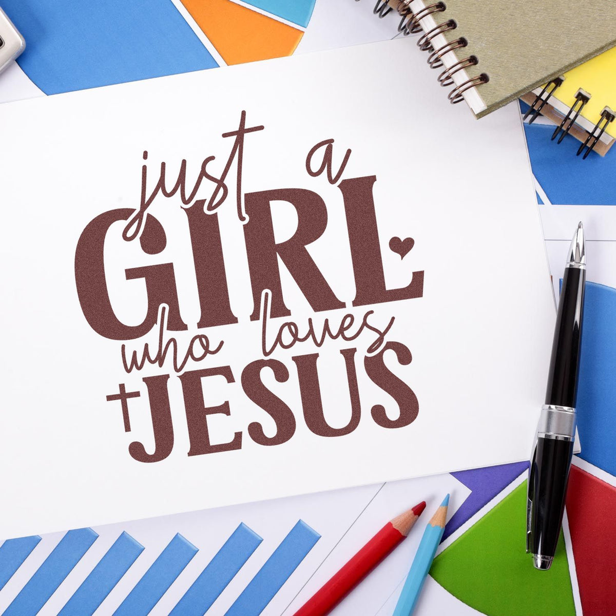 Brown custom stamp and seal design reading just a girl who loves JESUS on white paper with colorful stationery.