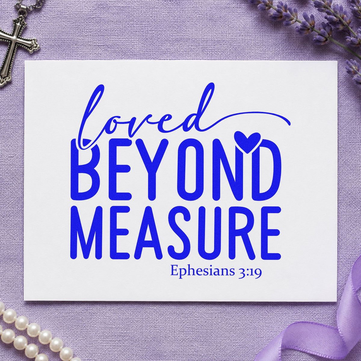 Loved Beyond Measure craft stamp imprinted in blue ink on paper, a design suited to adoption day gifts.