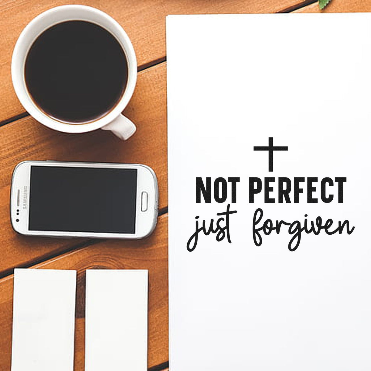 Not Perfect Just Forgiven Premium Wood-Mounted Stamp - Vintage Pro imprint stamped in black ink. A small cross tops "Not perfect, just forgiven" in bold and script lettering.