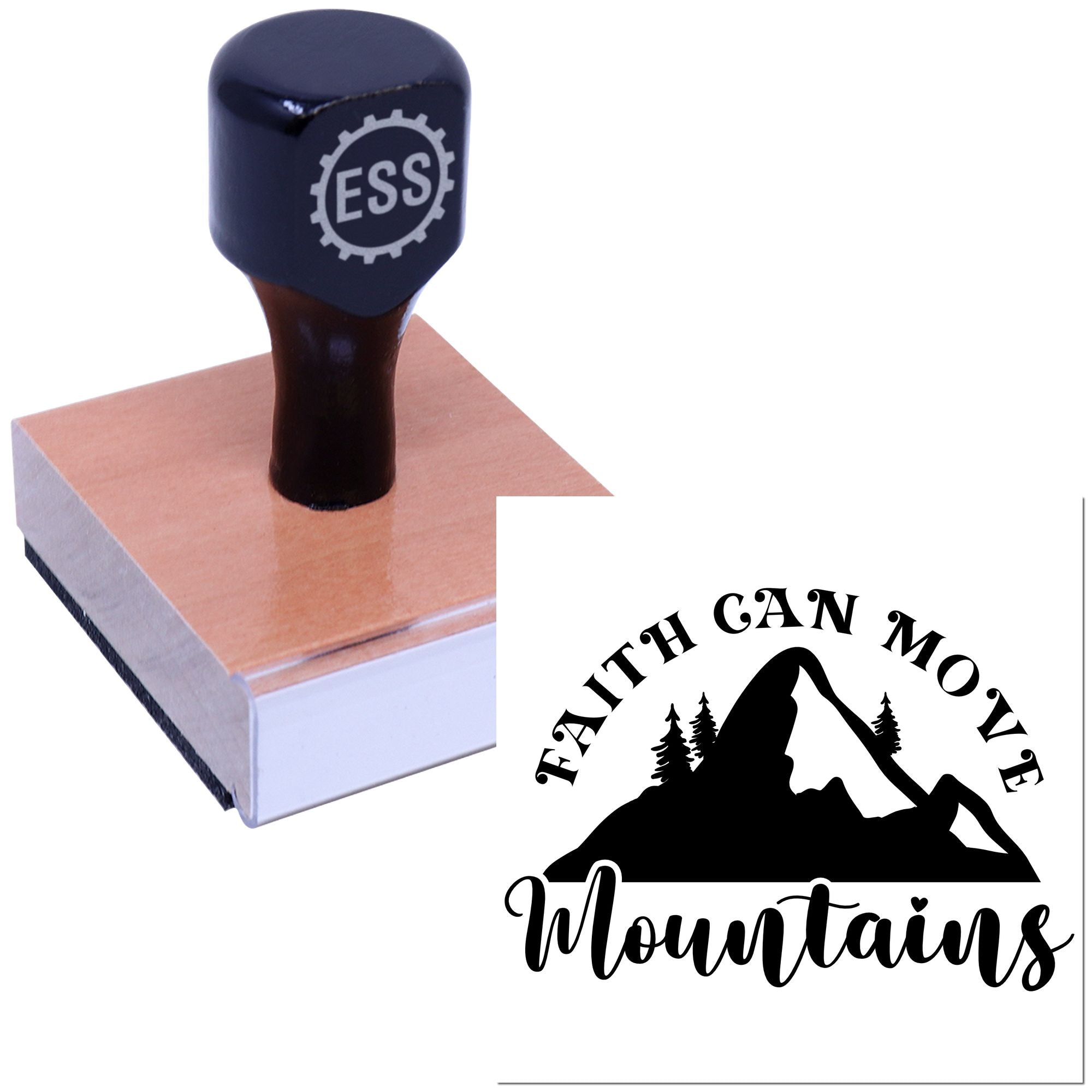 Black ESS rubber stamp on wooden base beside custom seal reading Faith Can Move Mountains with mountain silhouette.