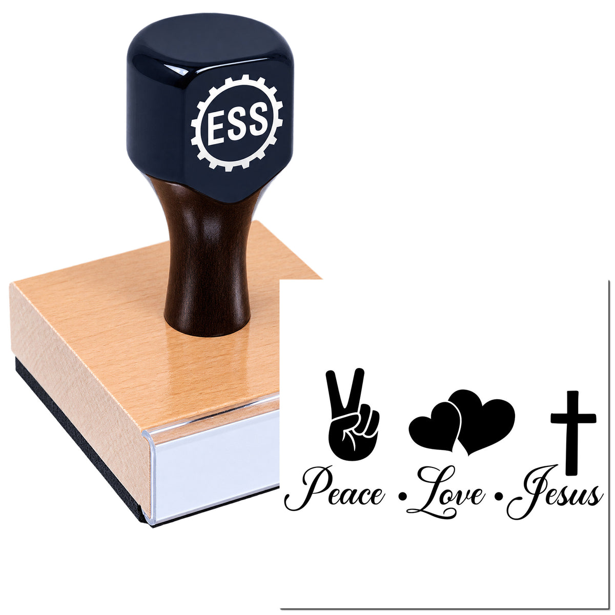Dark navy ESS rubber stamp and seal on a wooden block, showing Peace, Love, Jesus symbols in black.