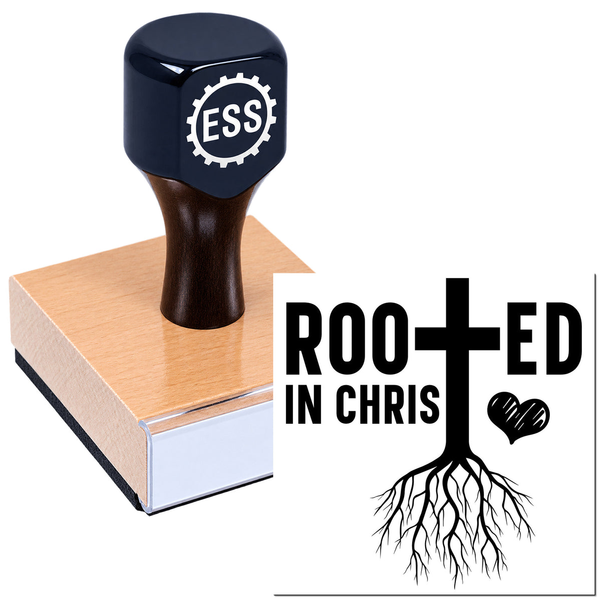 Black ESS rubber stamp on wood block with Rooted in Christ cross-and-roots seal design in black and white.