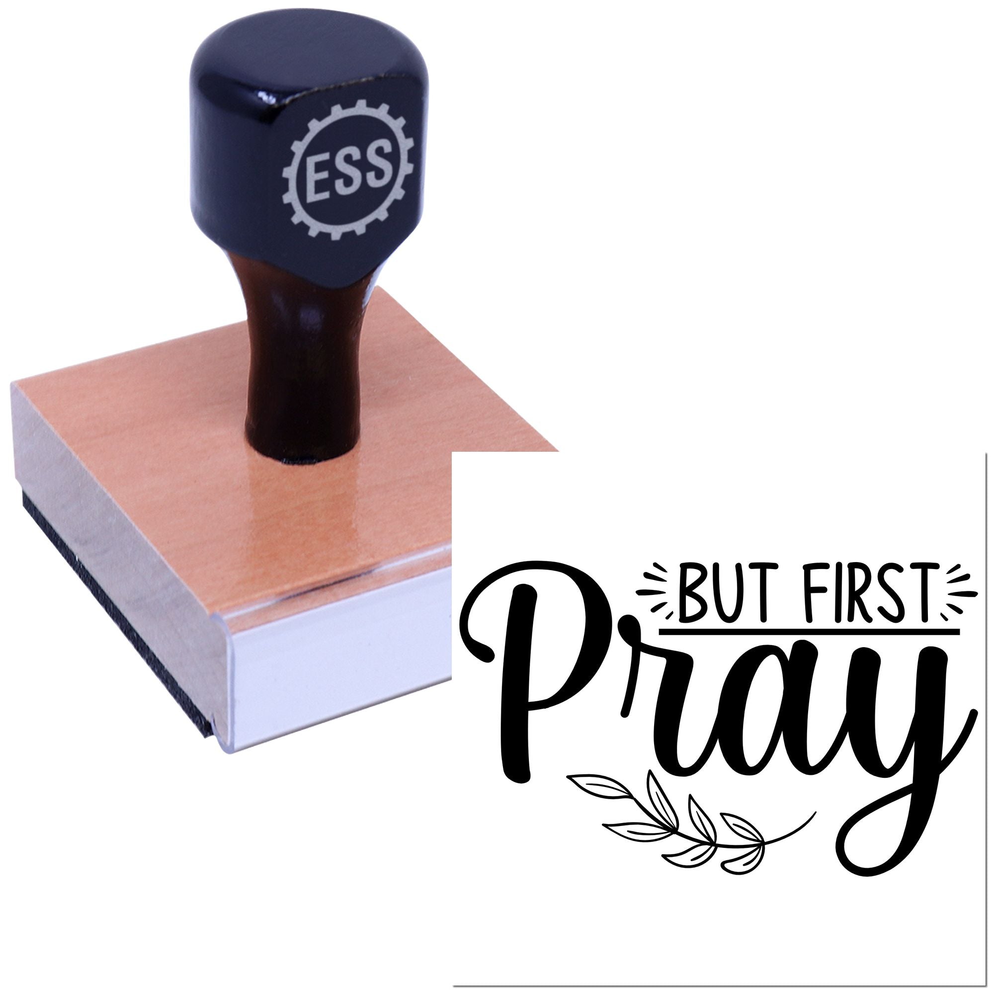 Black ESS rubber stamp on wooden block beside a But First Pray seal in bold black script with leaf accent.