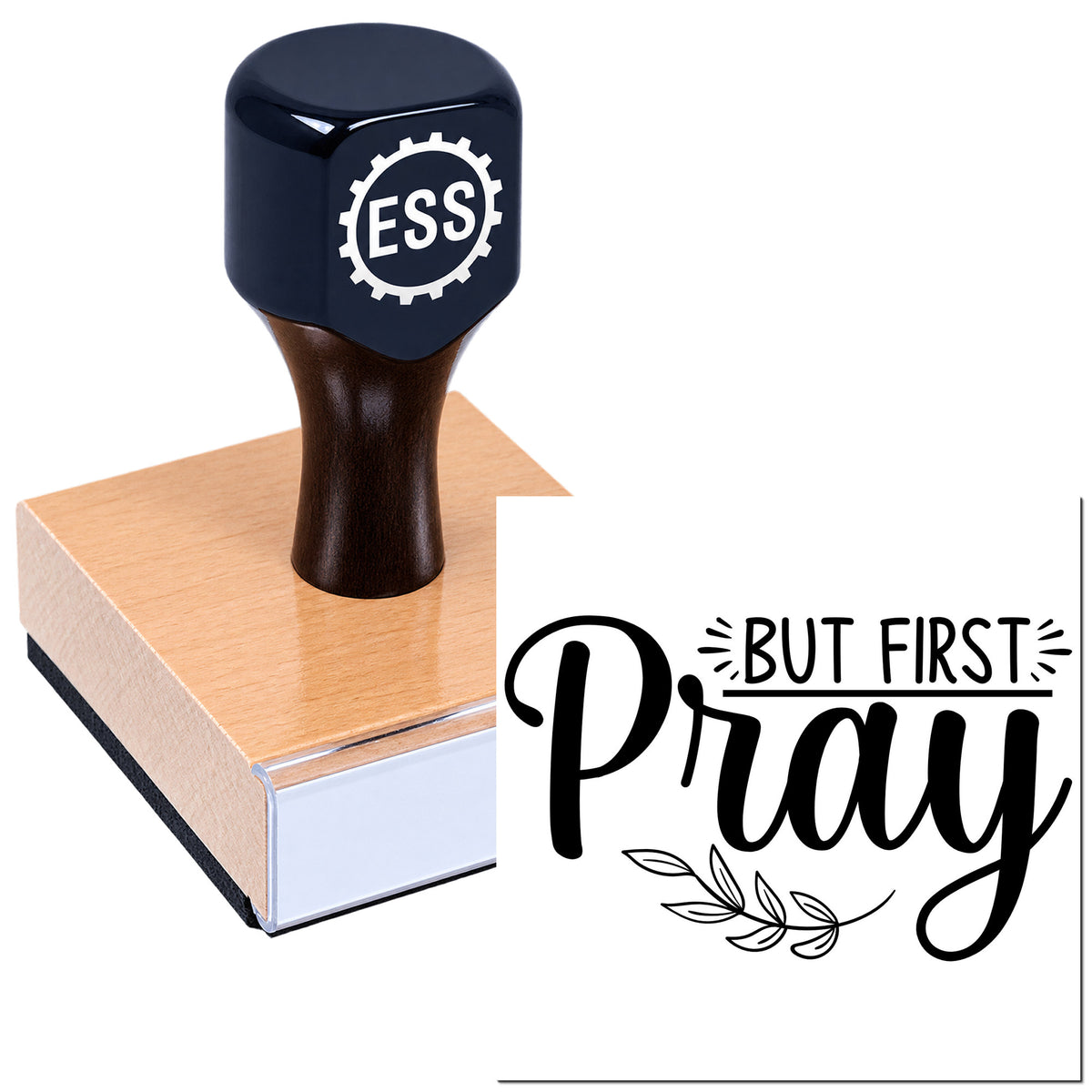 Black ESS rubber stamp on wooden block beside a "But First Pray" seal in bold black script with leaf accent.