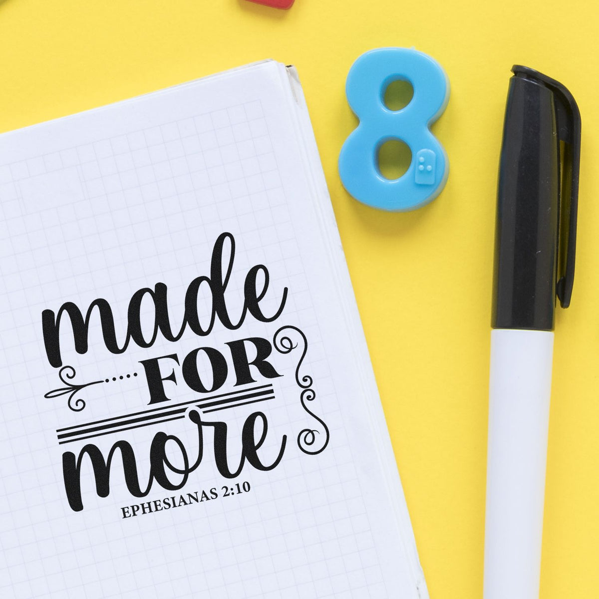 Custom stamp and seal products: black made for more imprint on white grid notebook, blue 8, black-and-white marker on yellow.