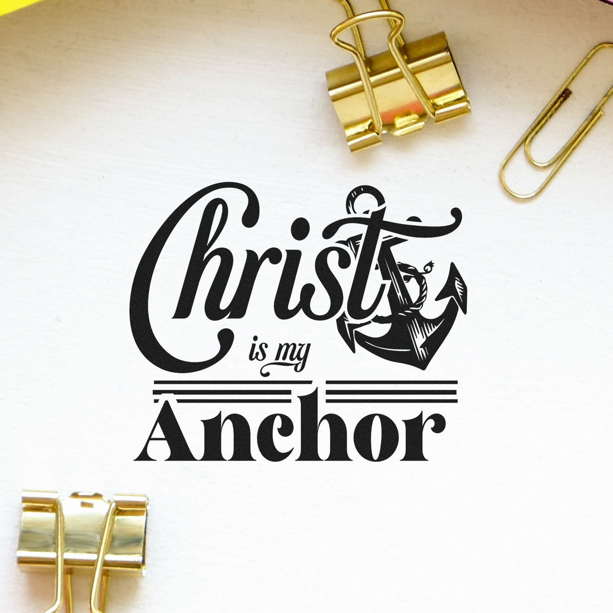 Black Christ is my Anchor stamp and seal design with anchor graphic on white paper, framed by gold binder clips.