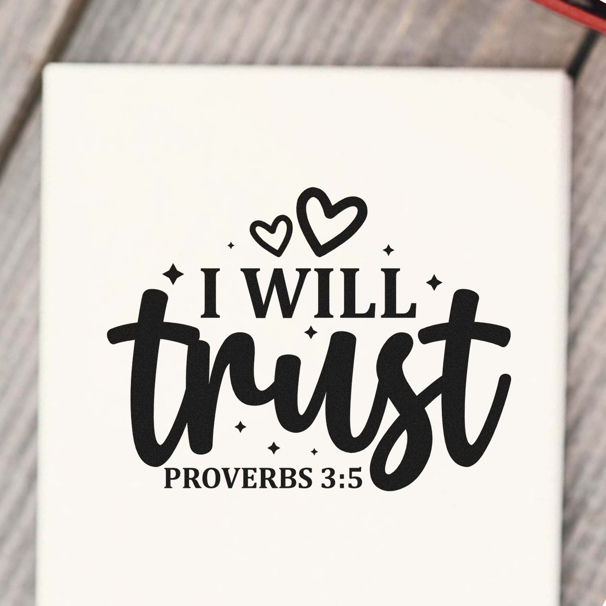 Black scripture stamp design on white, reading I WILL trust with hearts, stars, and Proverbs 3:5.