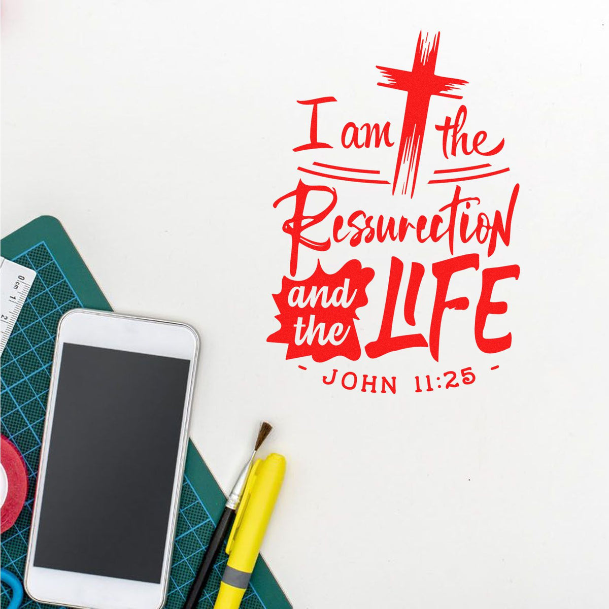 Red Christian stamp and seal design reading I am the Resurrection and the LIFE with John 11:25 on white background.