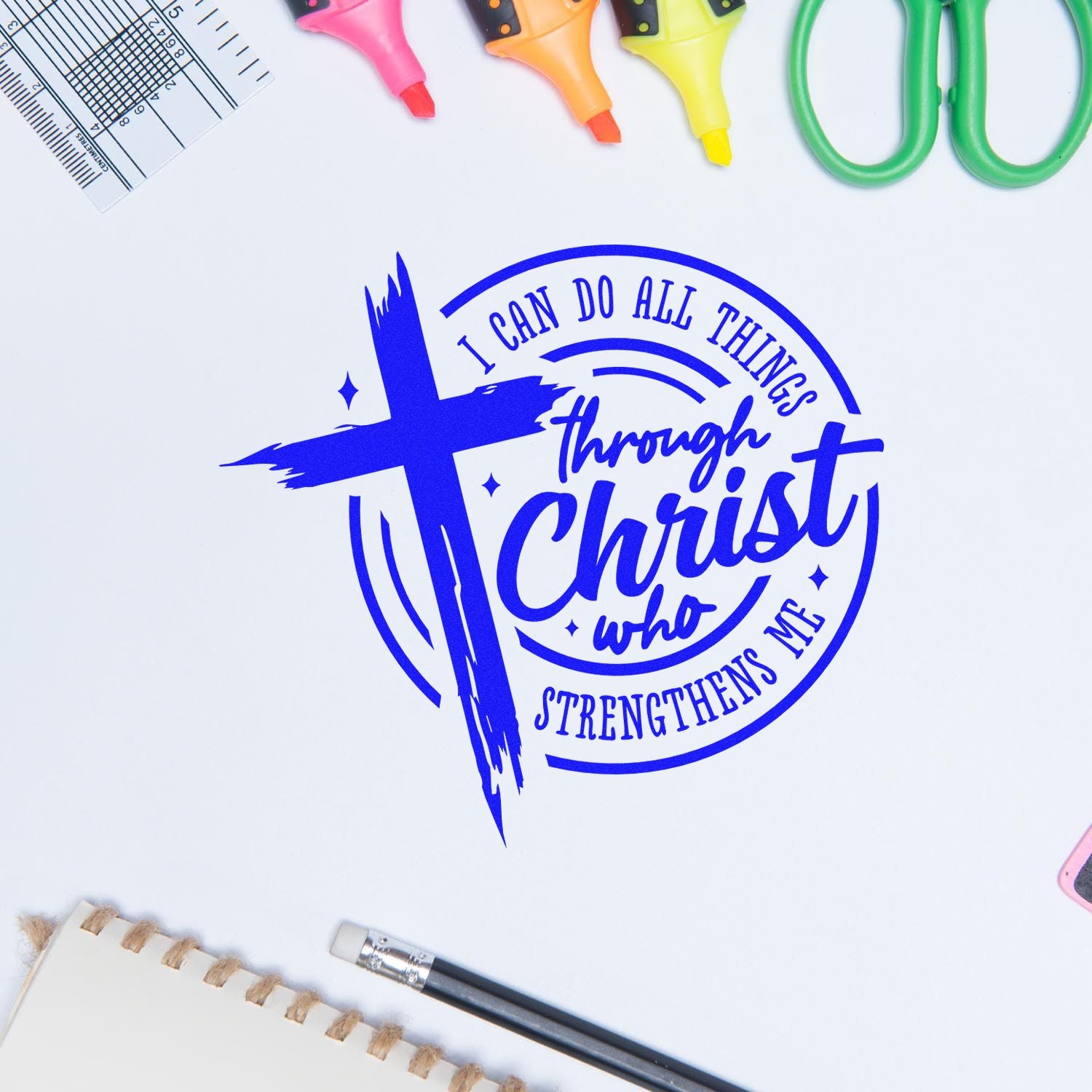 Blue Christian cross seal stamp with I can do all things through Christ and colorful craft tools on a white background.