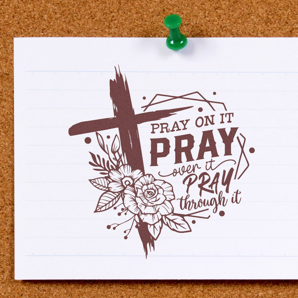 Brown prayer stamp and seal design with cross, flowers, and Pray on it, pray over it, pray through it on white paper.