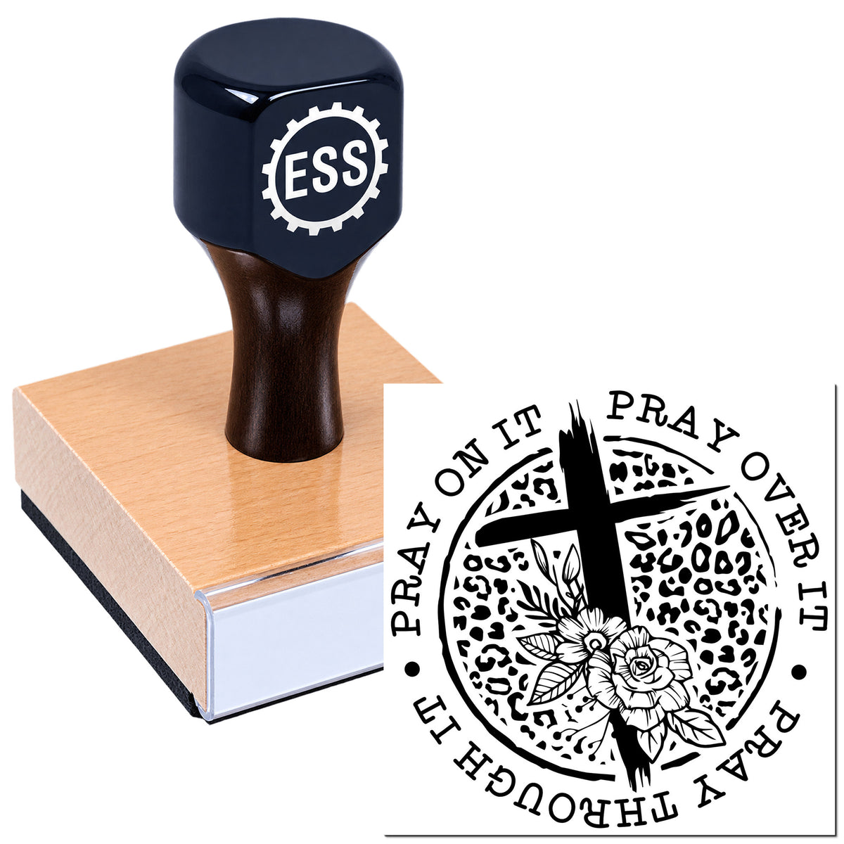 Dark navy ESS rubber stamp on a wooden block beside a black circular prayer seal with cross and floral design.