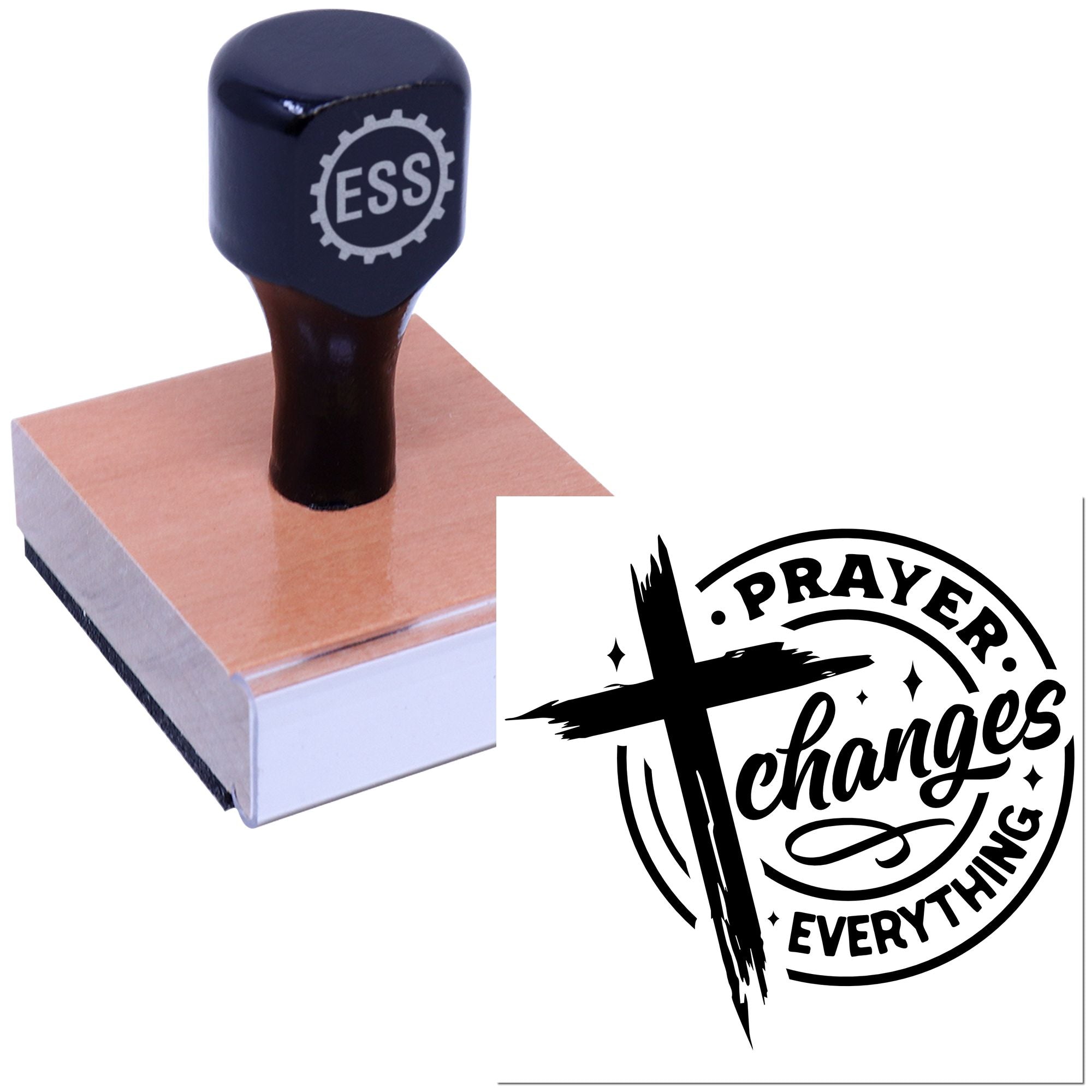 Navy ESS rubber stamp on wooden block beside black circular prayer seal reading "Prayer Changes Everything".