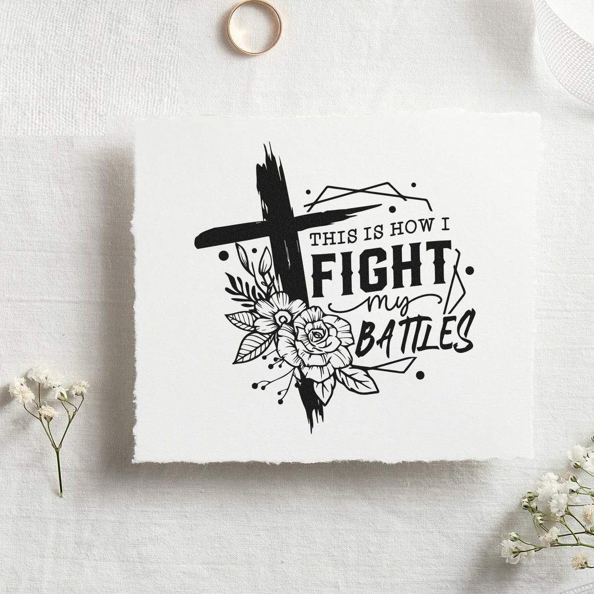 Black custom stamp and seal design with floral cross and This Is How I Fight My Battles on white paper.