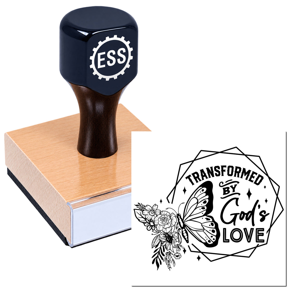 Black ESS custom stamp and seal on wooden block, with floral butterfly design reading "Transformed by God's Love."