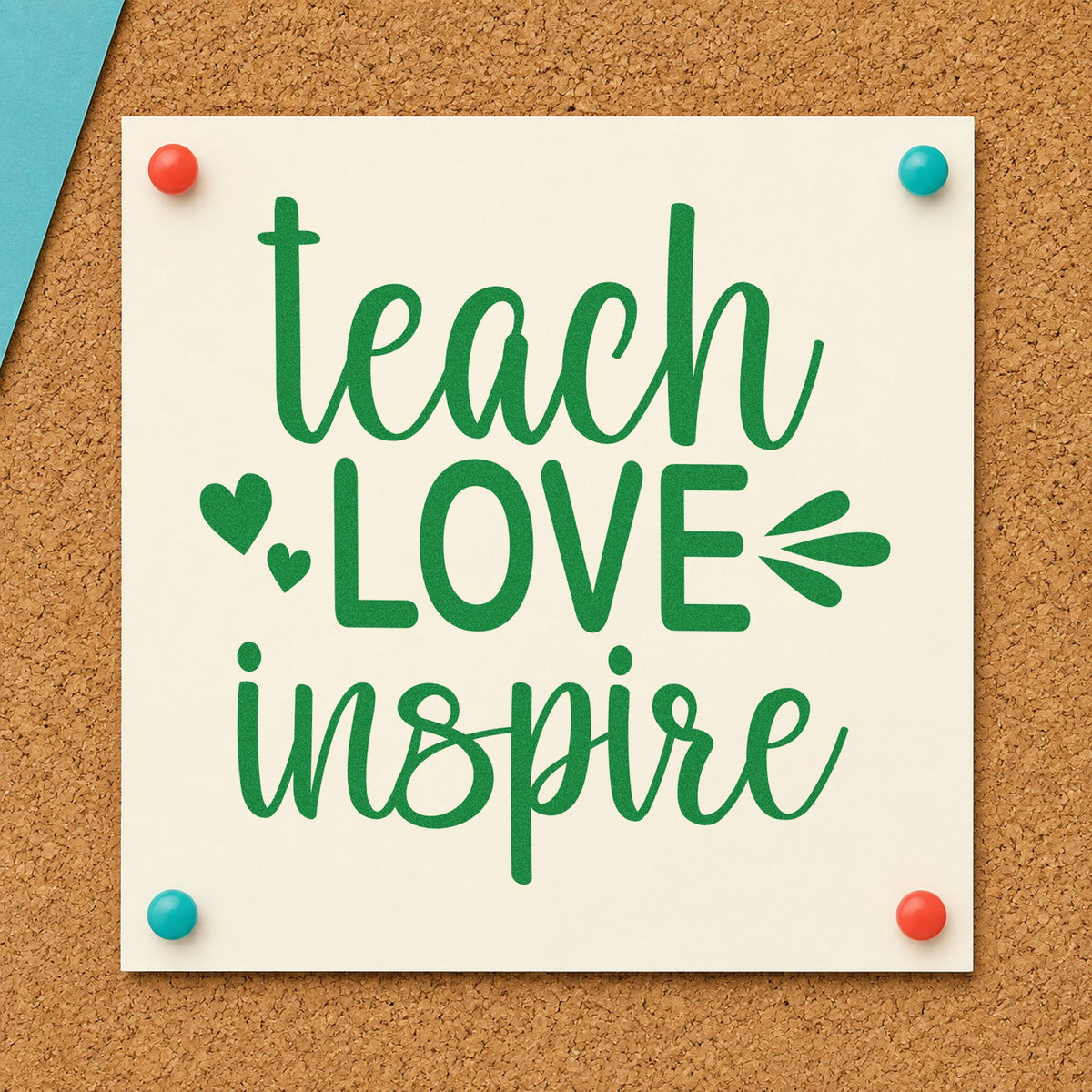 Teach Love Inspire Hearts craft stamp imprint in green ink on a handmade project, one idea being framed studio wall.