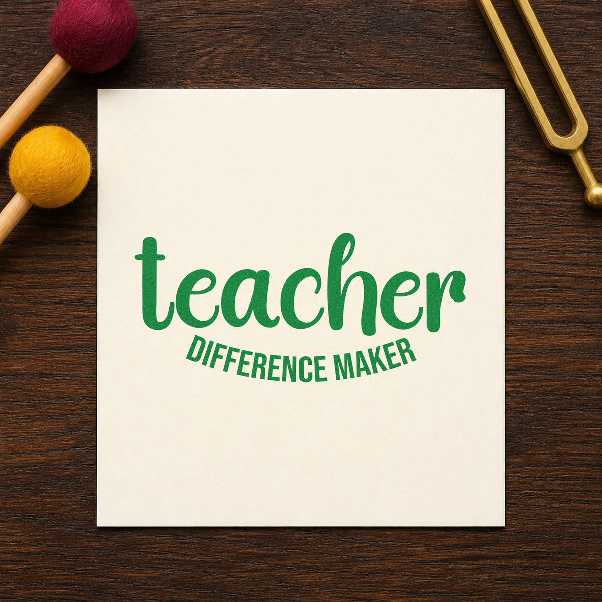 Teacher Difference Maker craft stamp imprint in green ink on a handmade project, one idea being framed entrance wall.