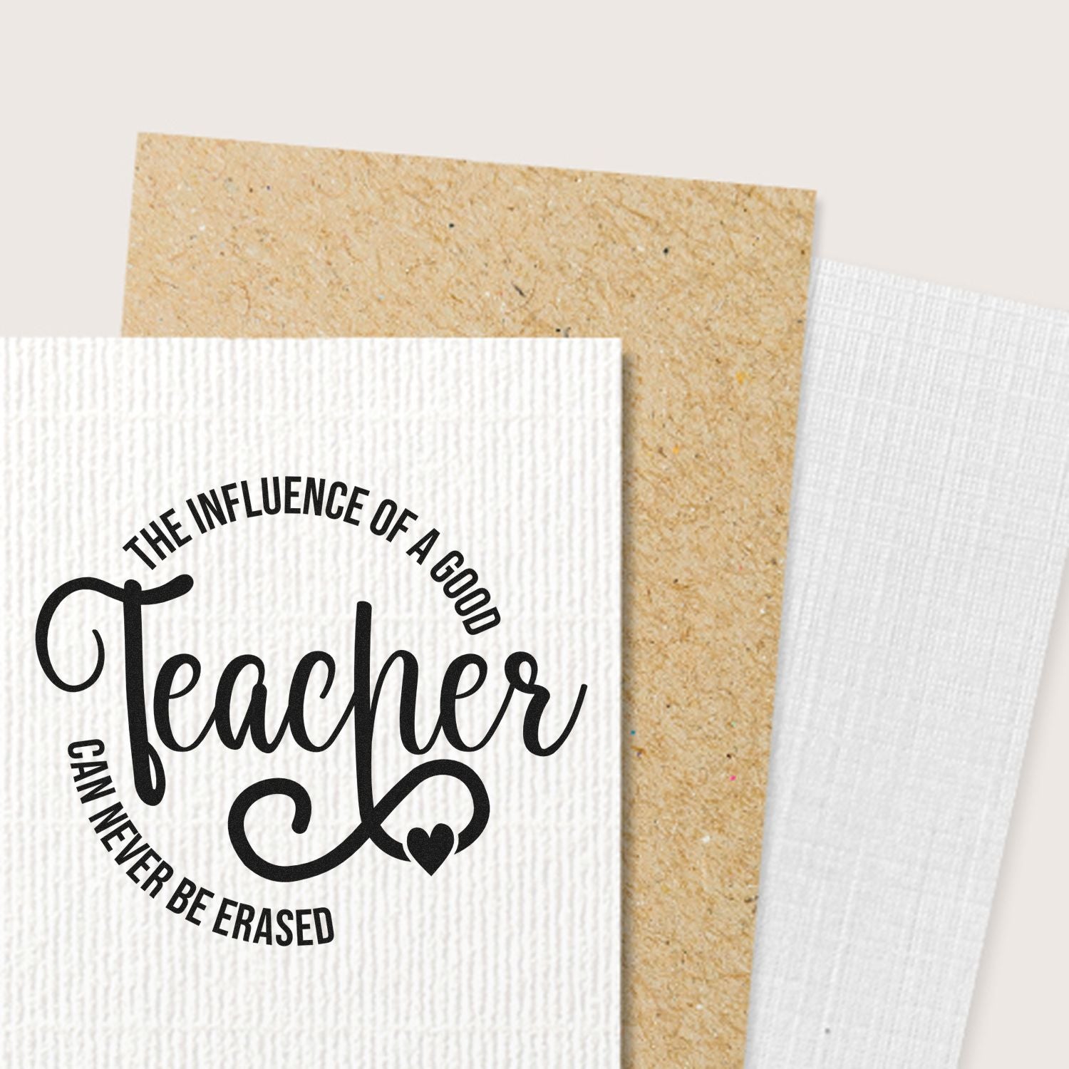 Black Teacher stamp on white textured paper with tan and white seal sample cards, featuring a heart accent.