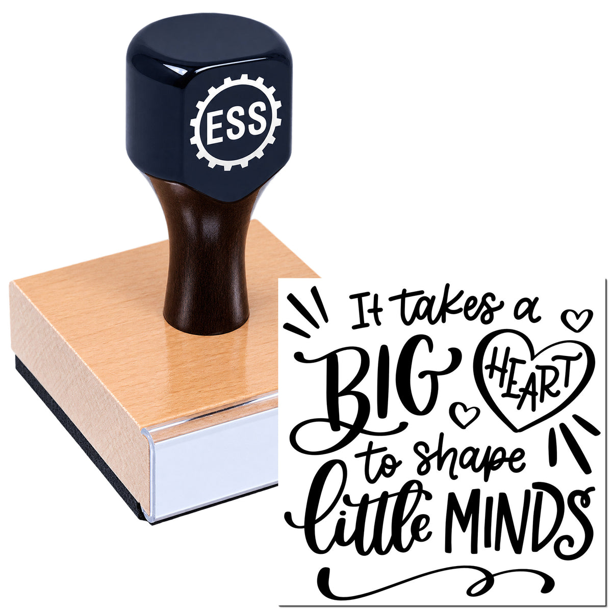 Black ESS stamp and seal on a wooden block, showing a white quote design: "It takes a BIG HEART to shape little MINDS."