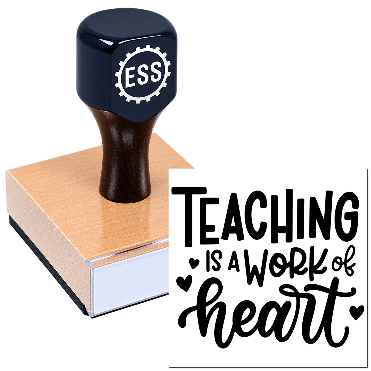 Navy ESS rubber stamp seal on a wooden base beside a white card reading "Teaching is a work of heart"