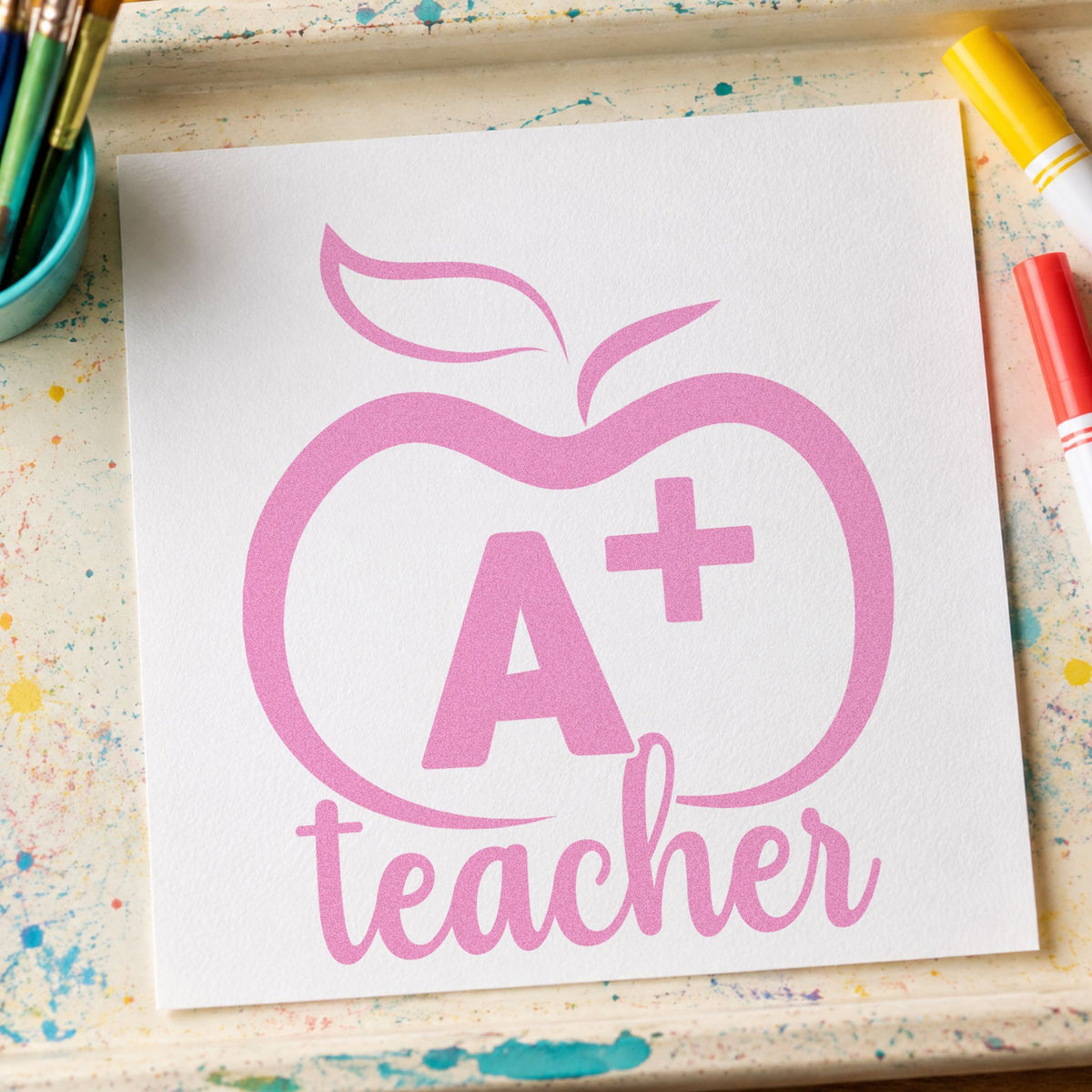 A Plus Teacher Outline Apple craft stamp in purple ink on cardstock, an easy option for banquet seat tags.