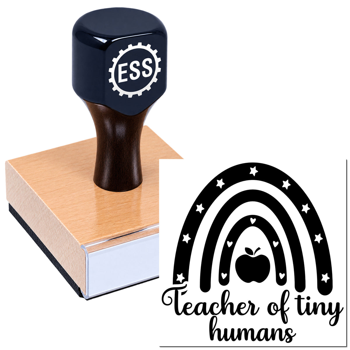 Navy rubber stamp on pink wooden block with ESS logo and rainbow "teacher of tiny humans" seal design.