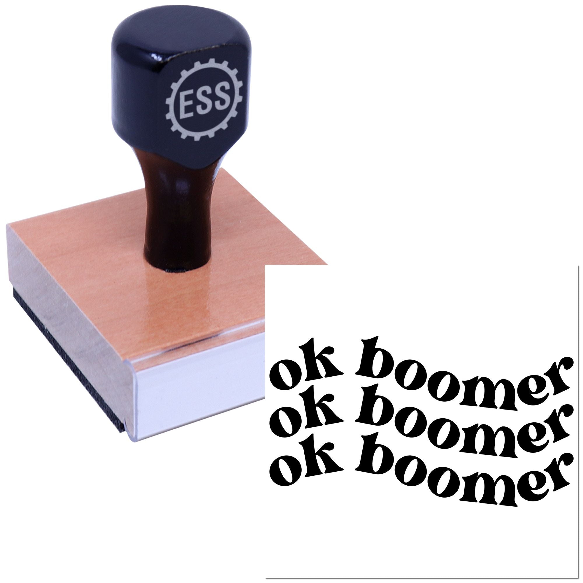 Dark navy ESS rubber stamp with gear logo on a copper seal block, beside black ok boomer imprint text.