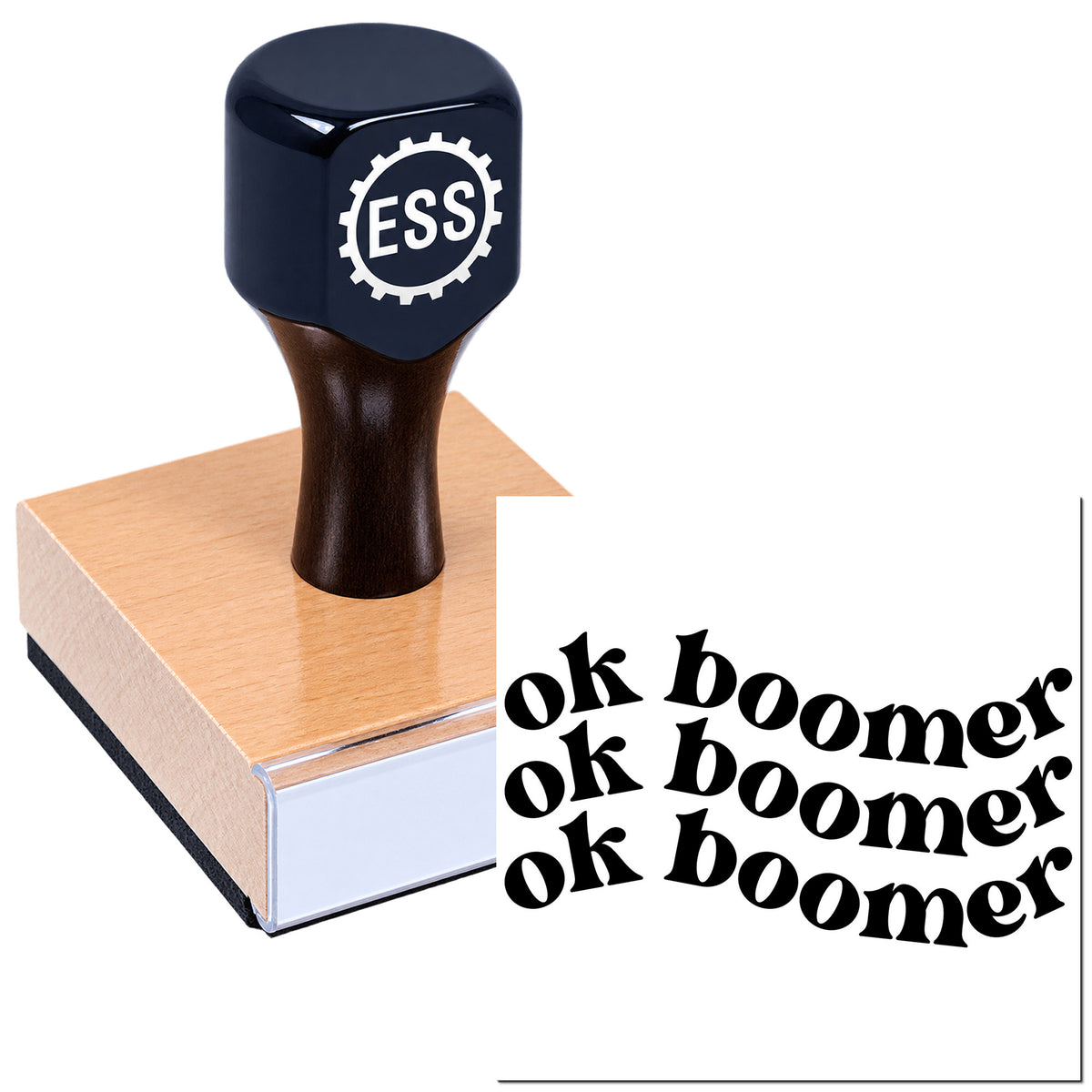 Dark navy ESS rubber stamp with gear logo on a copper seal block, beside black "ok boomer" imprint text.