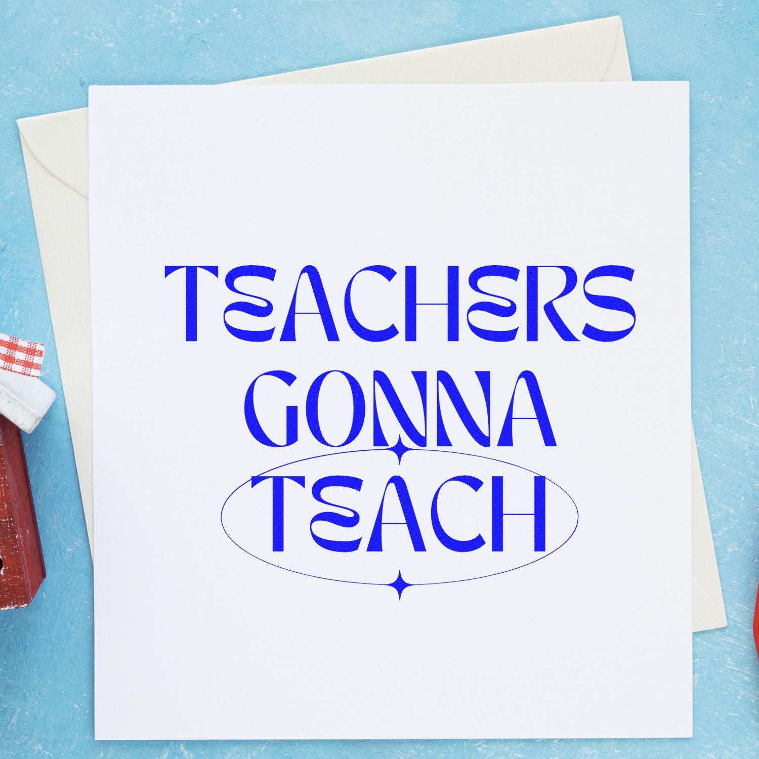 White card with blue Teachers Gonna Teach text and oval seal, beside envelopes and red wax stamp on a blue background.