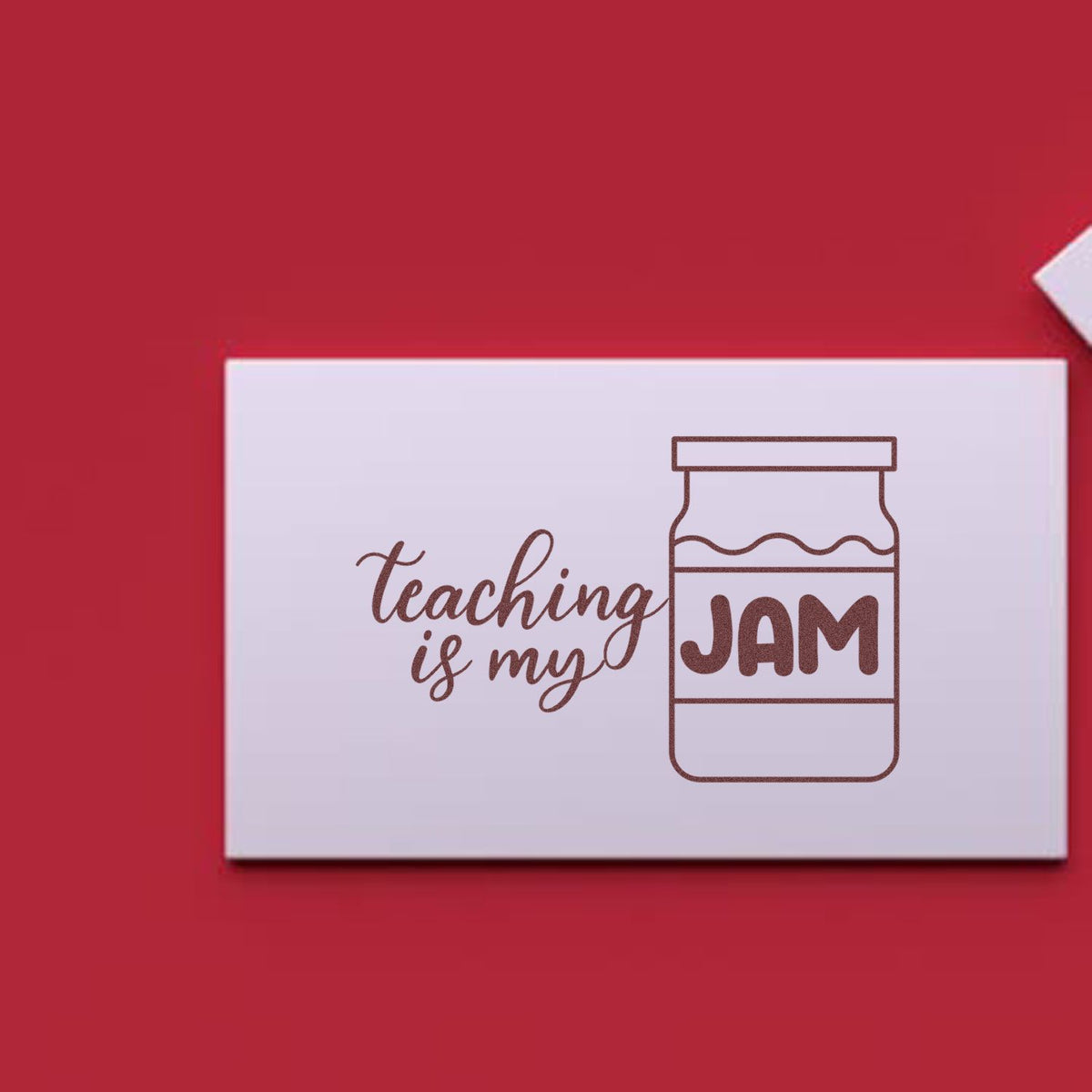 Maroon teaching-themed stamp seal with jam jar icon on a white card against a red background