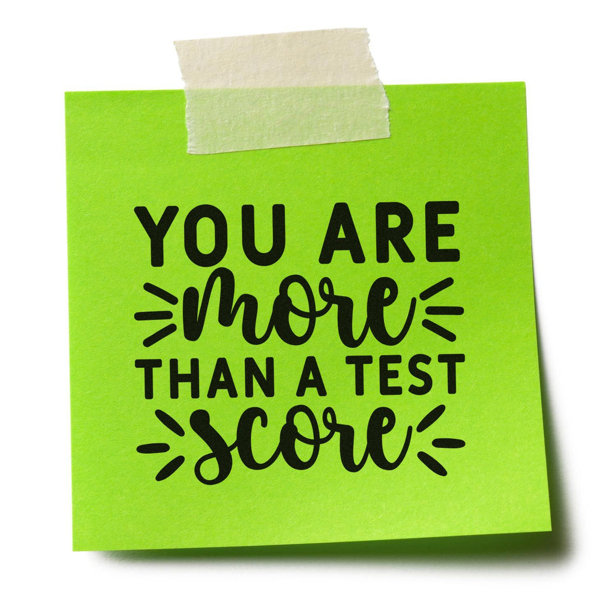 More Than Test Score Slim Pre-Inked Stamp imprint stamped in blue ink. “You Are More Than a Test Score” mixes bold capitals, script, and accent rays.