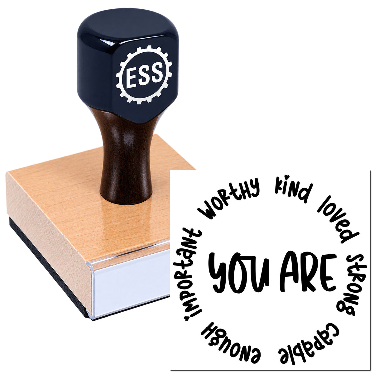 Dark navy custom stamp and seal on a pink wooden block, with circular "You are worthy, kind, loved" impression.