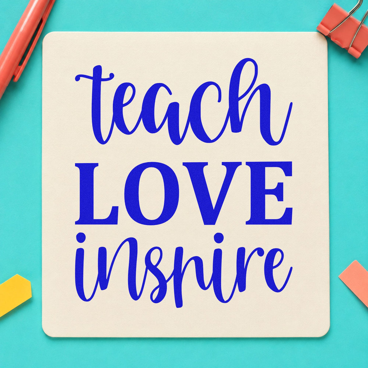 Teach Love Inspire Simple Script craft stamp imprinted in blue ink on paper, a design suited to gold foil seals.
