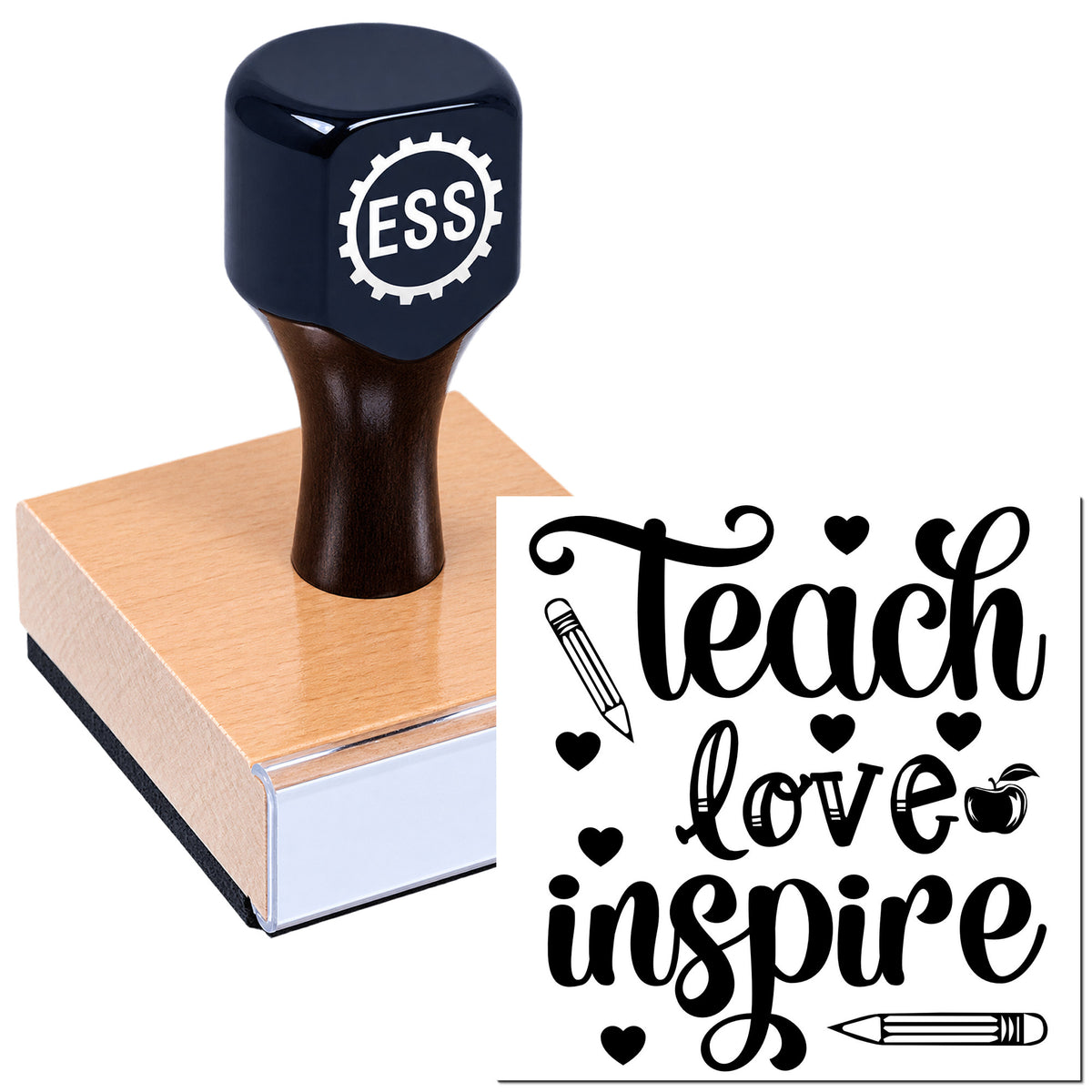 Navy ESS rubber stamp on wooden block with black "Teach, love, inspire" design, hearts and pencil icons.