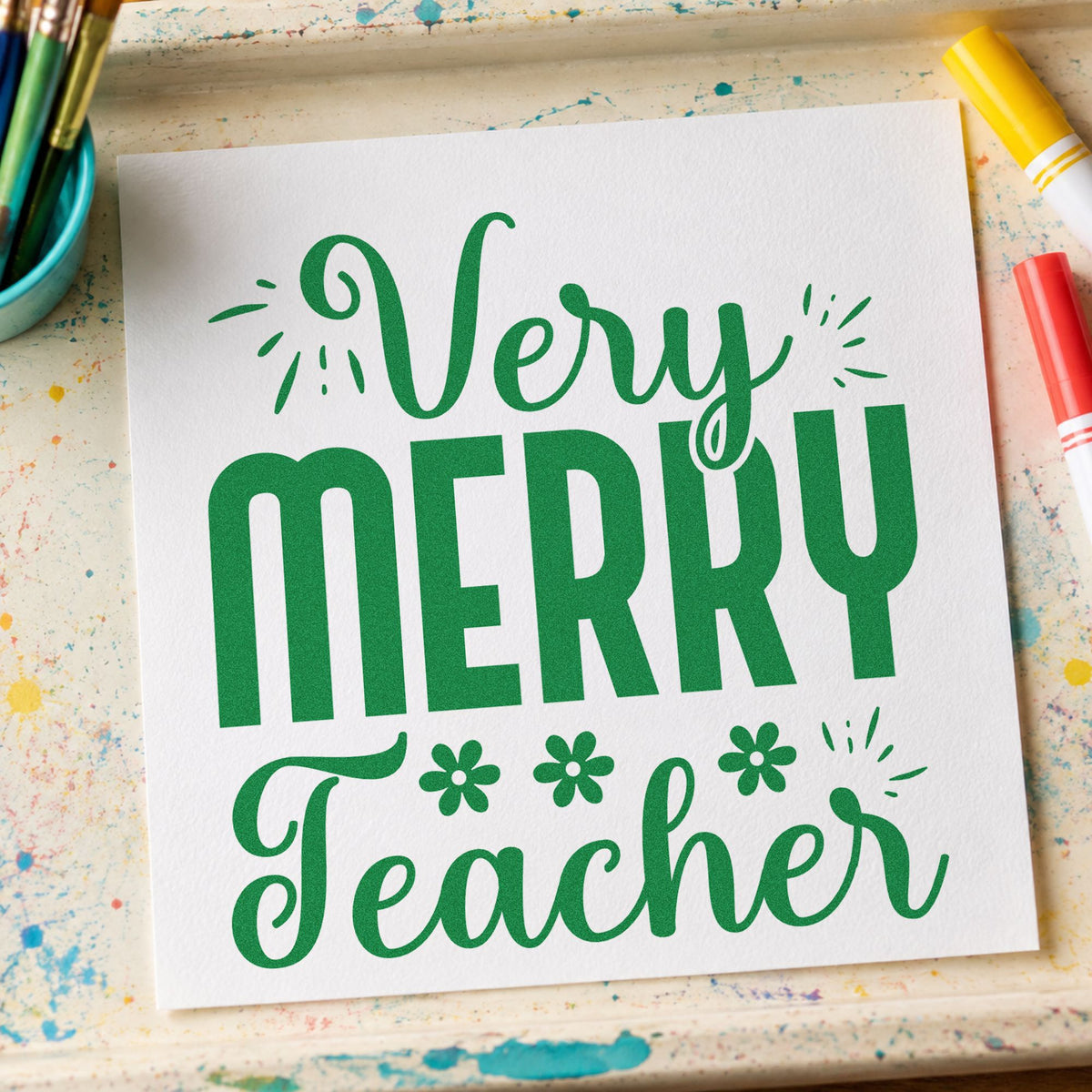 Very Merry Teacher Lettering craft stamp imprint in green ink on a handmade project, one idea being nativity script pages.