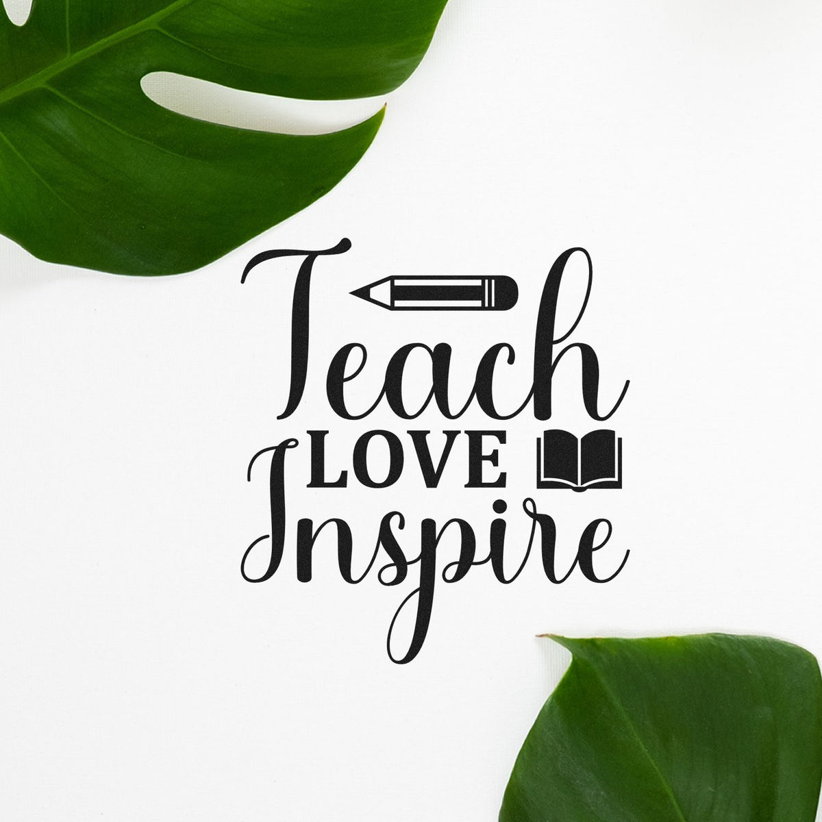 Teacher Love Inspire stamp seal with pencil and book, black text on white, framed by green leaves.