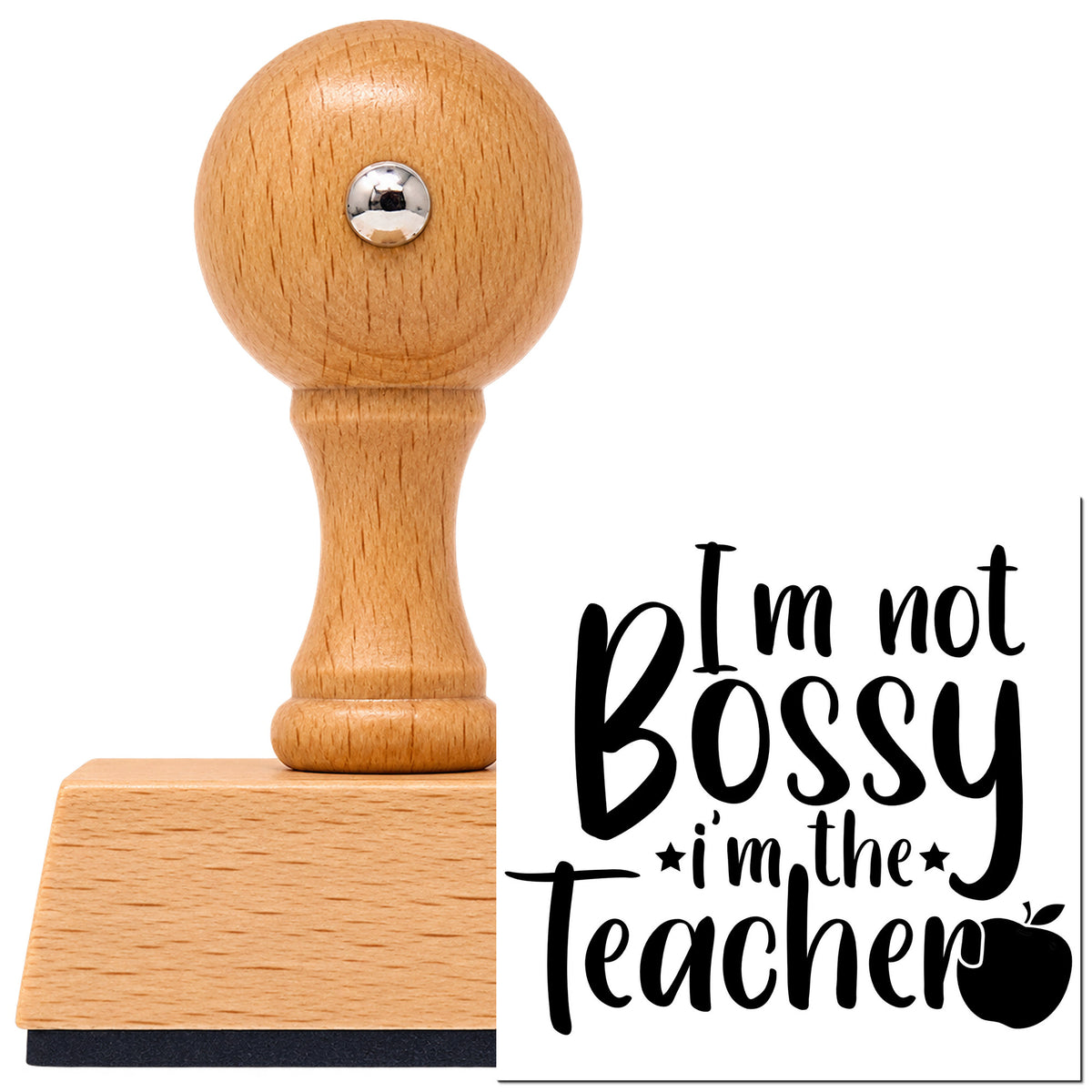 Vintage Pro beech wood stamp with a round knob handle, shown with its black I'm Not Bossy I'm The Teacher Apple imprint on white.