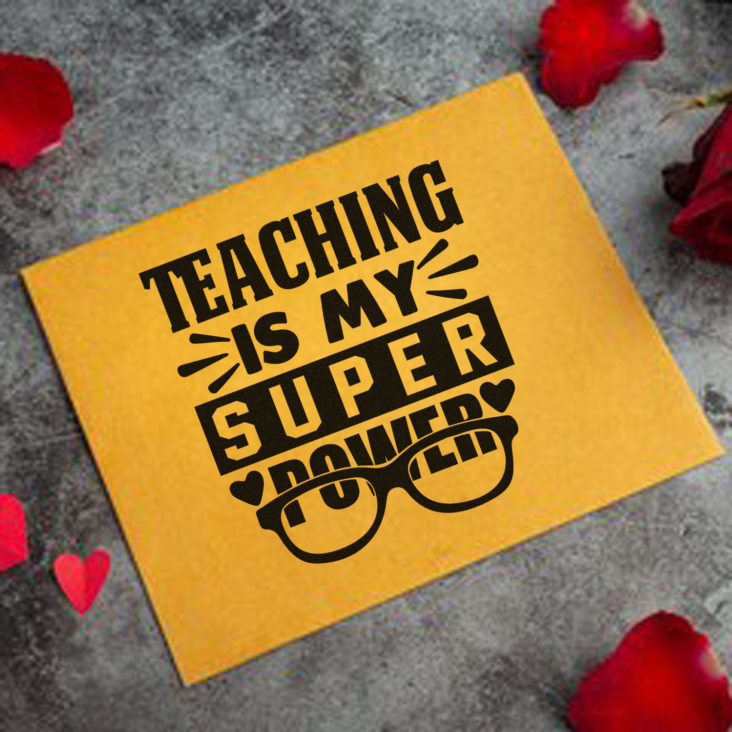 Yellow teaching stamp seal with black Teaching Is My Superpower text, glasses graphic, and red rose petals on gray background.