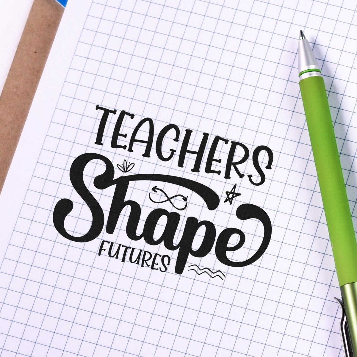 Figure-Eight Arrow Teachers Shape Futures Premium Wood-Mounted Stamp - Vintage Pro imprint stamped in black ink. "Teachers Shape Futures" appears with a small figure-eight arrow loop, a leaf-like accent, a star, and wavy decorative lines.