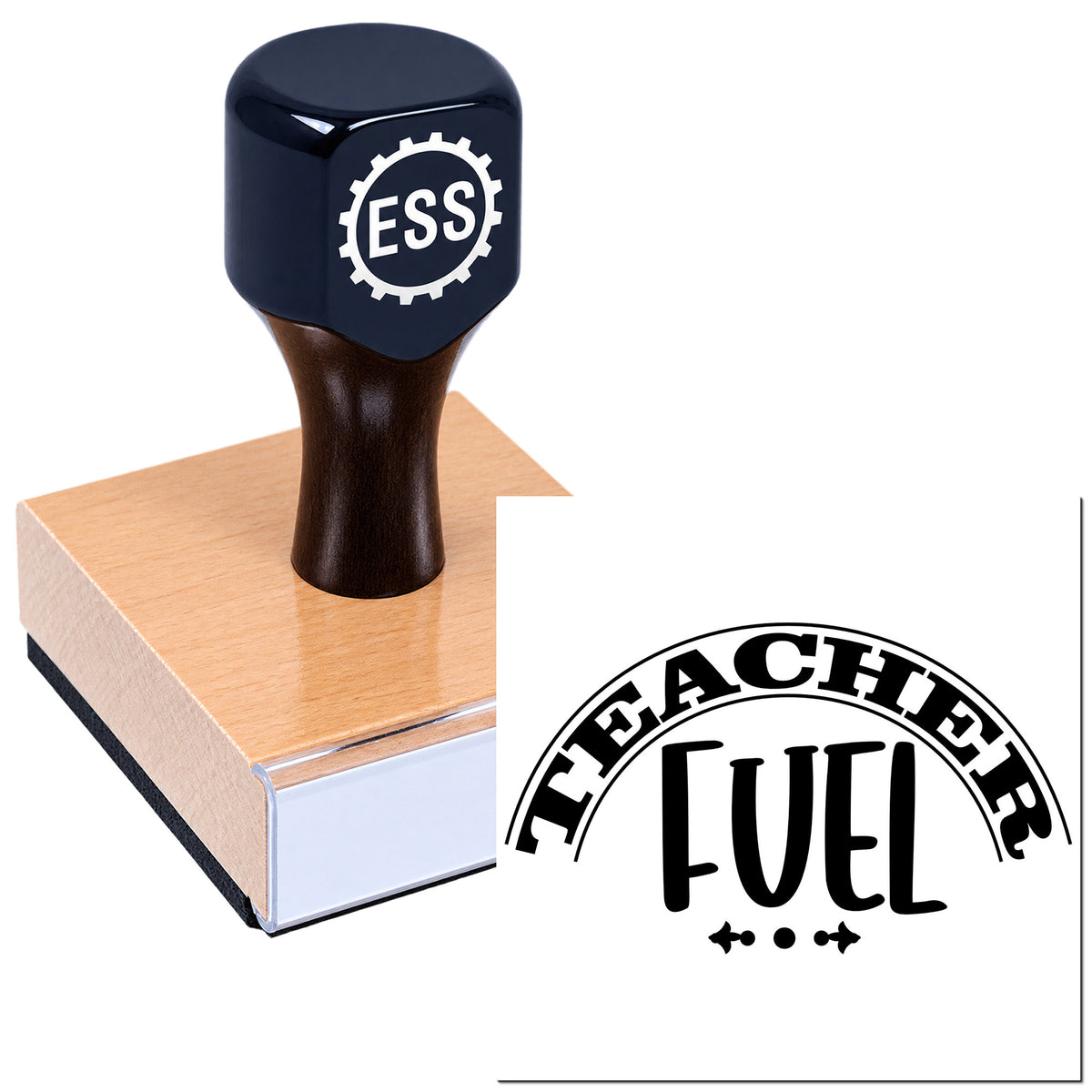 Black ESS rubber stamp and seal on wooden block with "Teacher Fuel" imprint in bold black on white.