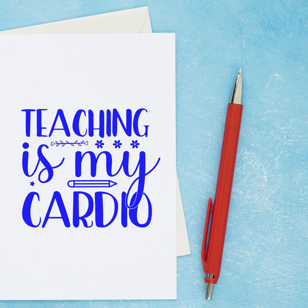Blue Teaching is my cardio stamp and seal on white card, with a red pen on a textured blue background.