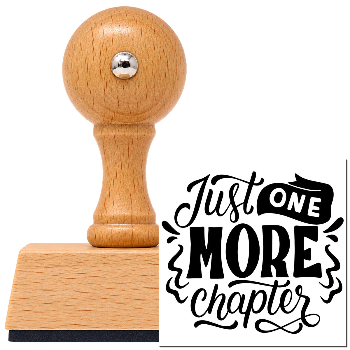Vintage Pro beech wood stamp with a round knob handle, shown with its black Just One More Chapter Ribbon Lettering imprint on white.