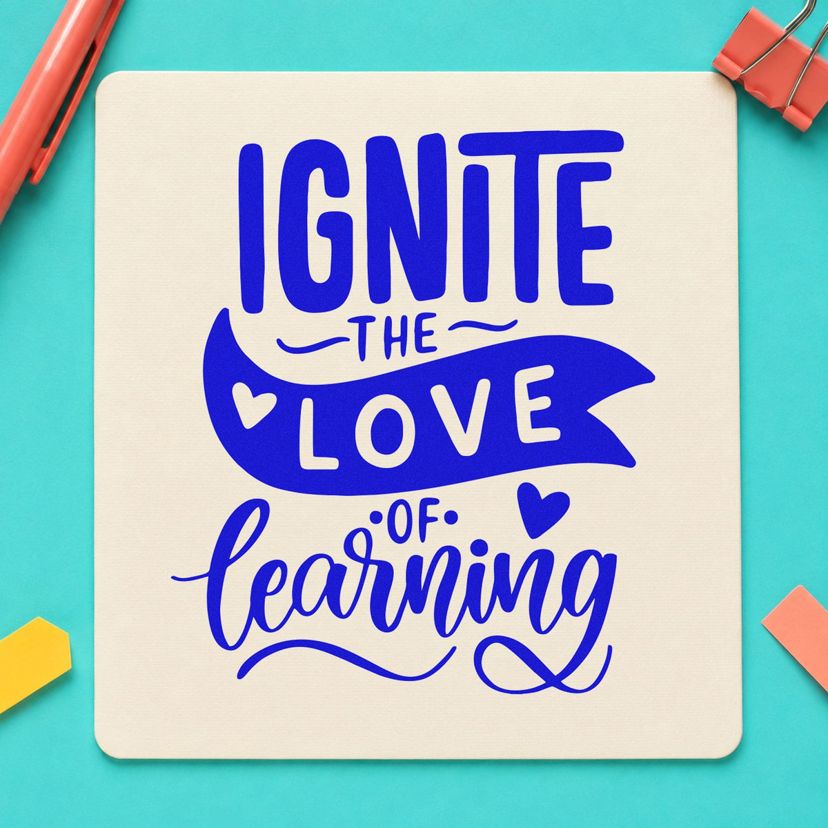 Ignite Love Of Learning craft stamp in blue ink on cardstock, an easy option for lab apron panels.