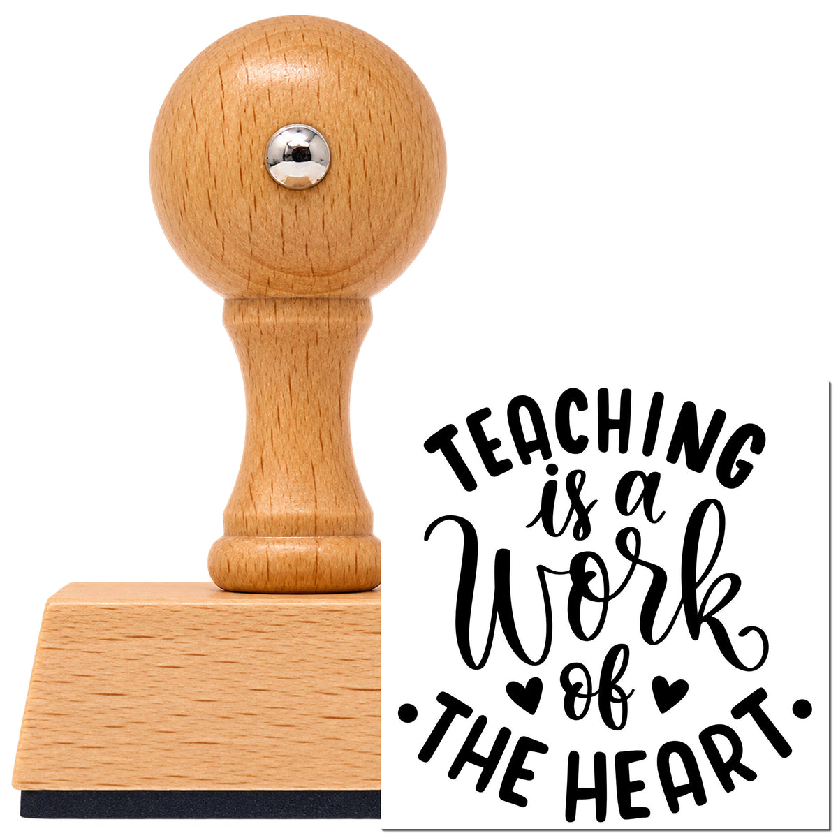 Vintage Pro beech wood stamp with a round knob handle, shown with its black Teaching Is A Work Of The Heart imprint on white.