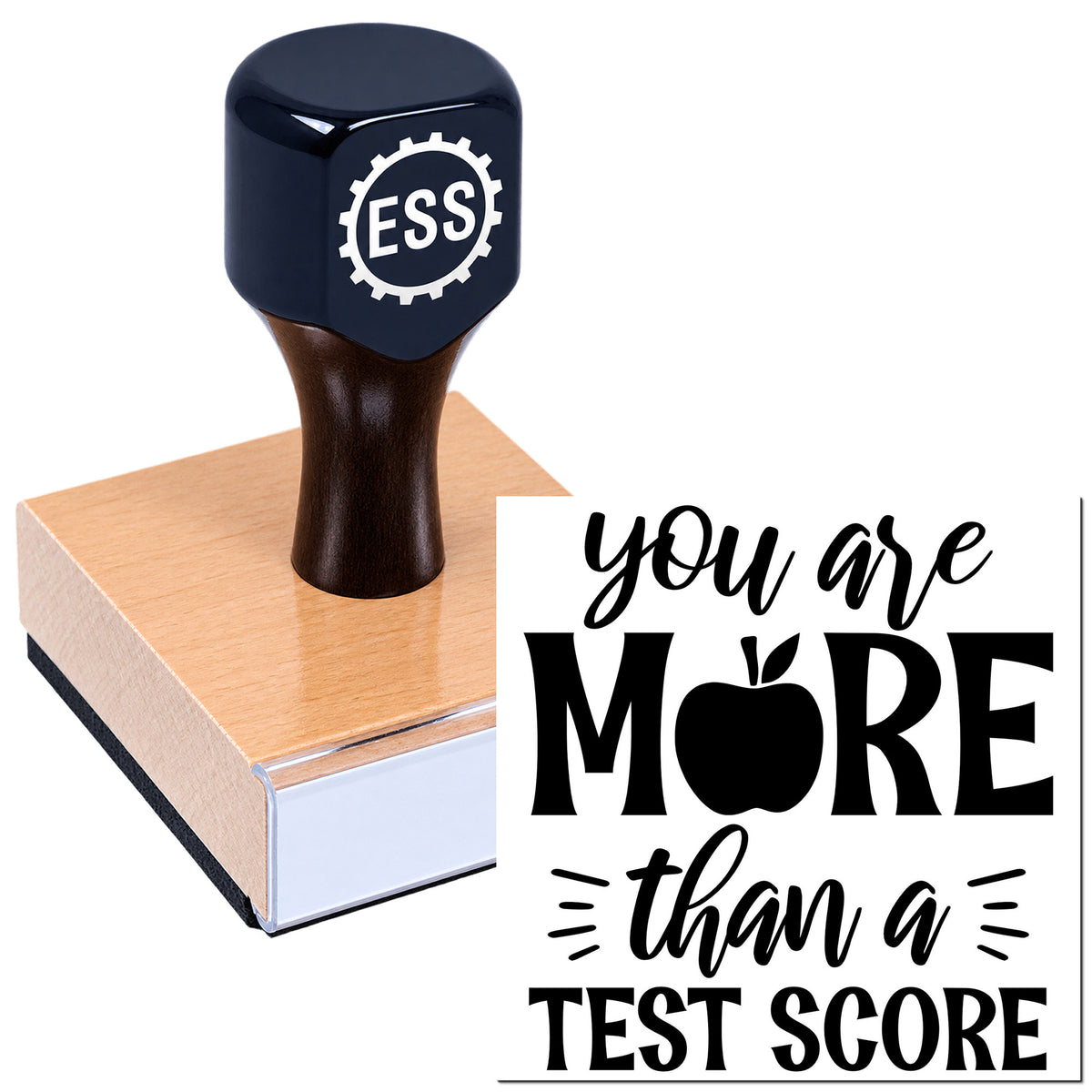 Black ESS stamp and seal on a wood block with bold black "you are MORE than a TEST SCORE" design.
